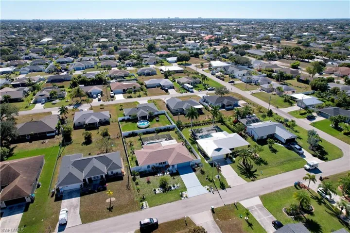 Aerial overview of property's location with nearby suburban area