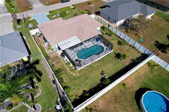 Aerial view of residential area featuring a pool area