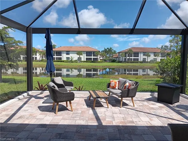 Outdoor conversation area with serene water view