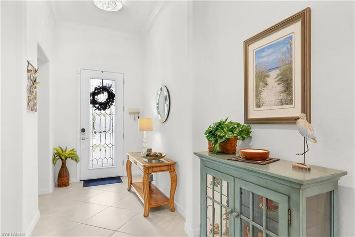 Upgraded door, crown molding, custom paint throughout
