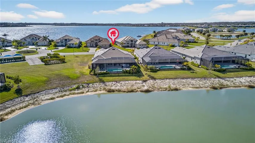Aerial perspective of suburban area with a nearby body of water