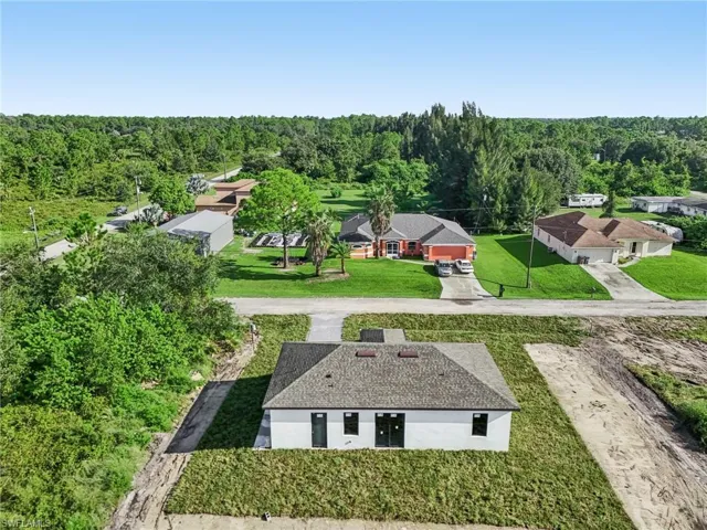 Aerial view of residential area with a forest