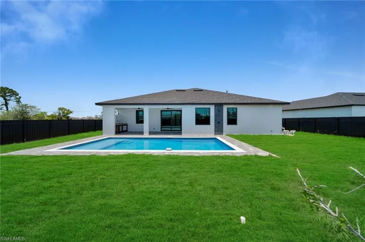 Back of house featuring stucco siding and a patio area