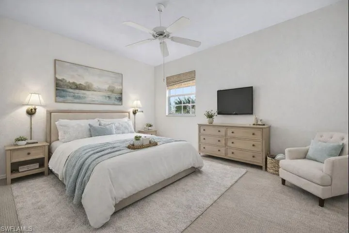 Bedroom with carpet and a ceiling fan