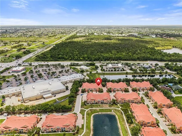Aerial perspective of suburban area with a nearby body of water