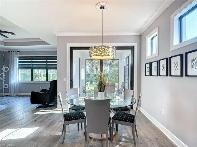 Dining room featuring crown molding and hardwood / wood-style flooring