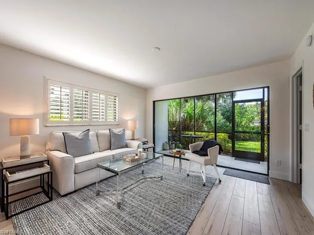 Living area featuring light wood finished floors and baseboards