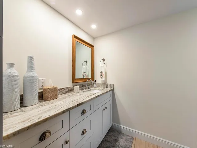 Bathroom featuring vanity, light wood-style floors, and recessed lighting