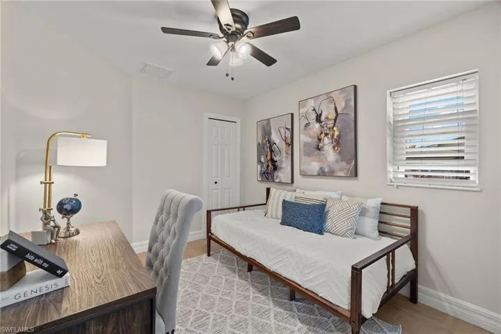Office area featuring ceiling fan and wood-type flooring