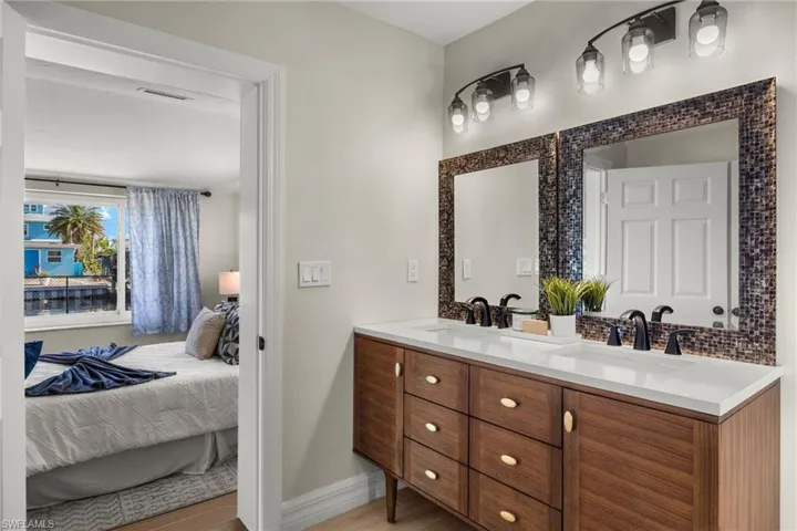 Bathroom featuring hardwood / wood-style flooring and vanity