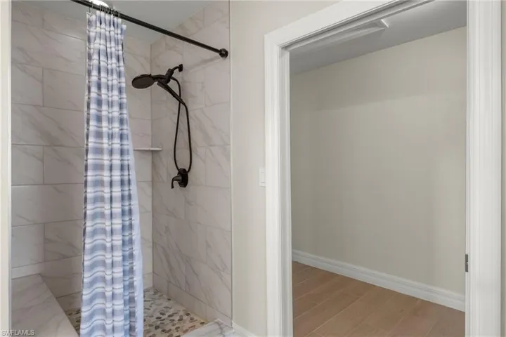 Bathroom with a shower with curtain