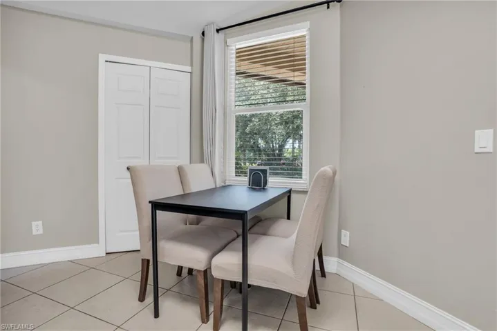 Dining space featuring light tile flooring