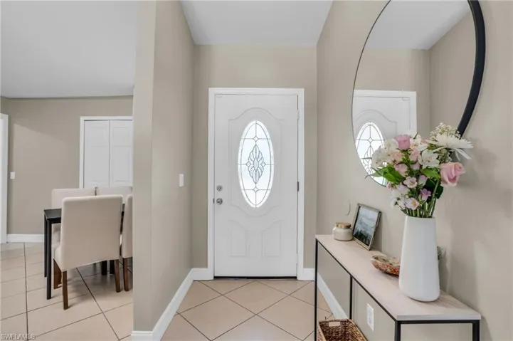 Entrance foyer with light tile floors