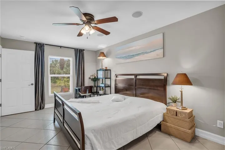 Tiled bedroom with ceiling fan