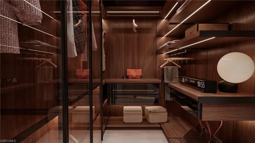 Wine room featuring wood walls and light wood-type flooring