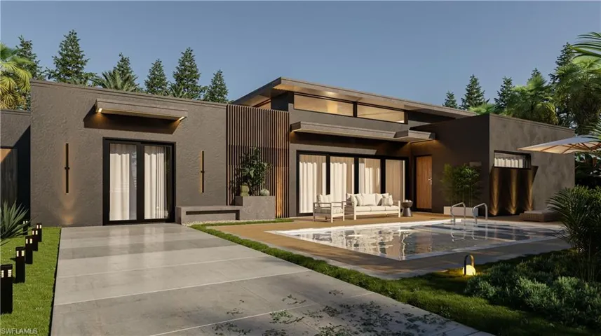 Rear view of house featuring outdoor lounge area, an outdoor pool, stucco siding, and a patio area