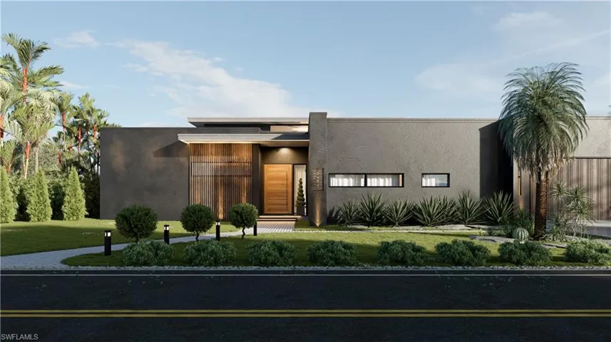 View of front of home with stucco siding and a front lawn