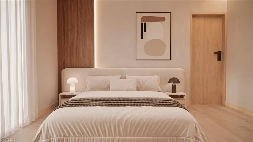 Bedroom with light wood-type flooring and baseboards
