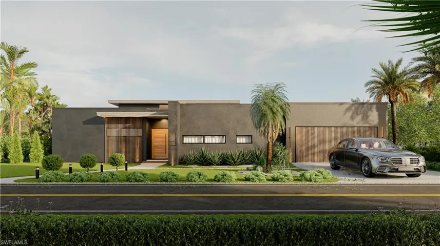 View of front of house featuring stucco siding, driveway, and a garage