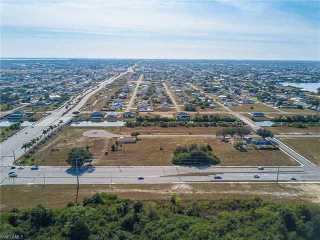 View of property location with nearby suburban area