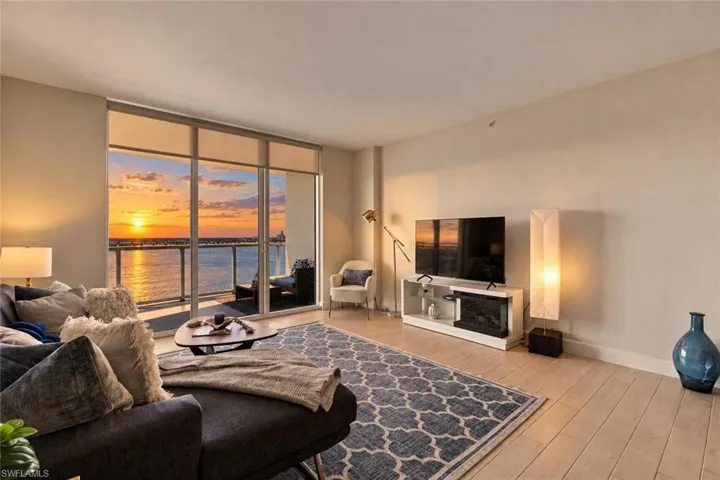 Floor-to-ceiling windows fill the open great room with light.
