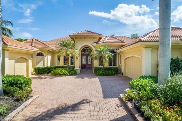 Imposing entry with 2 garages...one for two vehicles, one air conditioned for a single vehicle or storage or fitness recreation room...your choice. New roof 2019. Exterior repainted 2023.