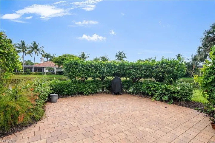Outdoor patio sun deck with grill, surrounded by Butterfly garden