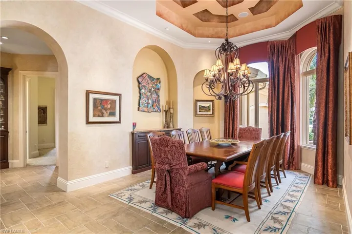Formal dining room with coffered ceiling, seating for 10