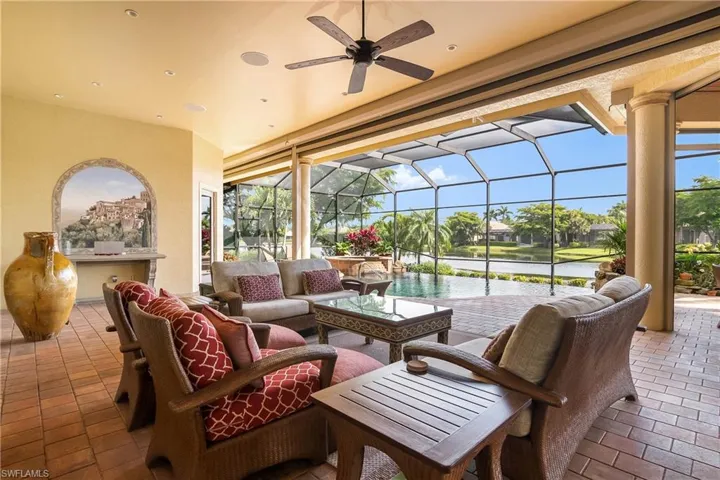 Lanai lounge area, panoramic water view...note hand painted Italian village wall scene