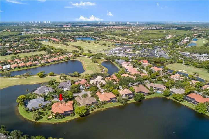 Aerial view, close-by country club and driving range center right...Beach condos to west and distant Ft. Myers 'skyline' extreme upper right. Twenty minutes to airport and beach and 5 minutes to Coconut Point outdoor mall shopping and dining.