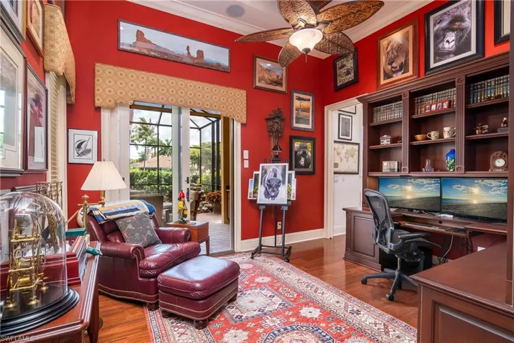 Den/study, built in cabinetry. Owner is an accomplished photographer and work is displayed.