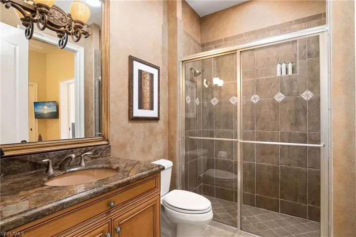 Guest bathroom, granite countertop, shower, custom mirror