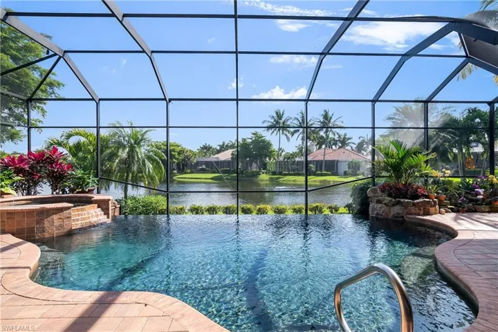 Rear lot boundary is 206 linear feet showcasing a 180 degree water view. Vanishing edge resort style saltwater pool and spa heated by natural gas.