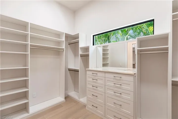 Primary Closet One of Two Large Walk-ins