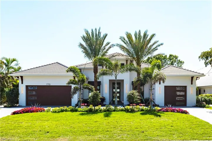 View of Front Facade Featuring Landscaping