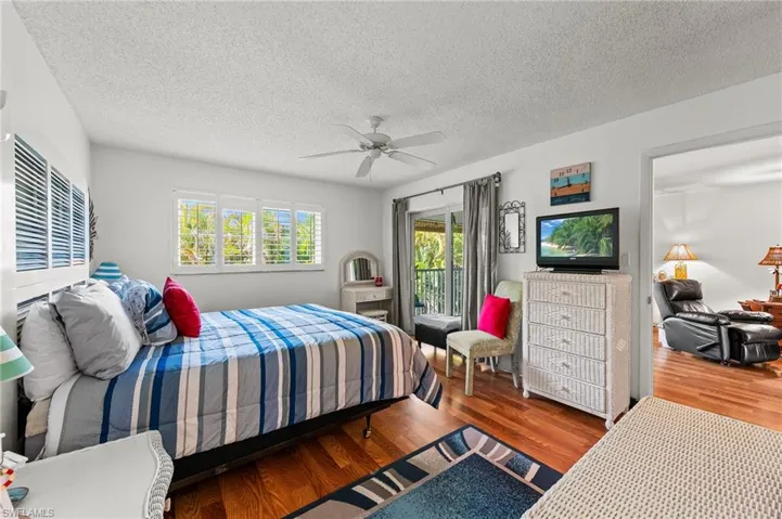 Primary bedroom with sliders to lanai