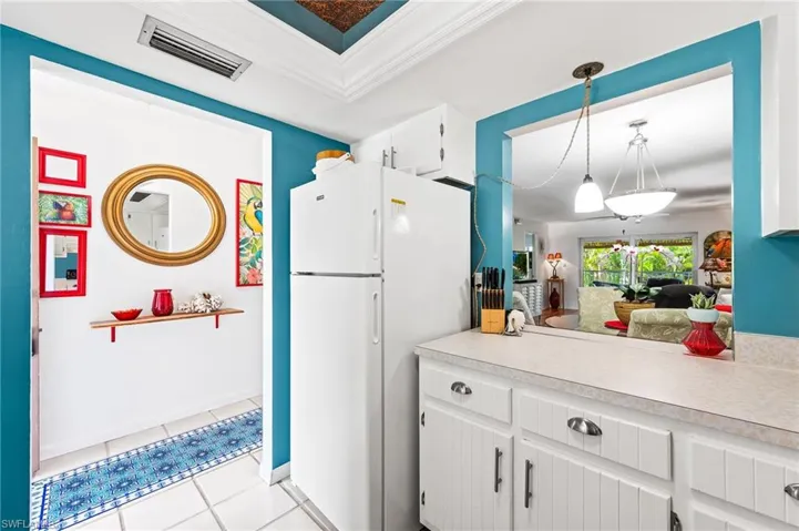Kitchen with pass through to dining