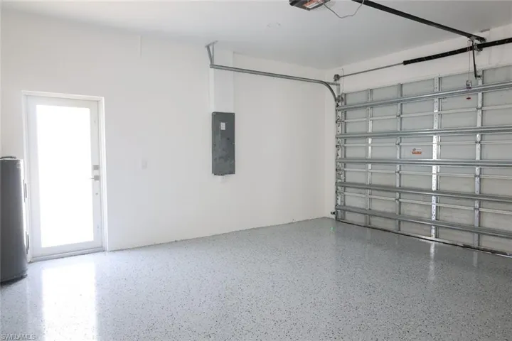 Garage with electric panel and water heater
