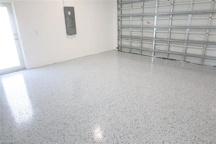 Garage featuring electric panel