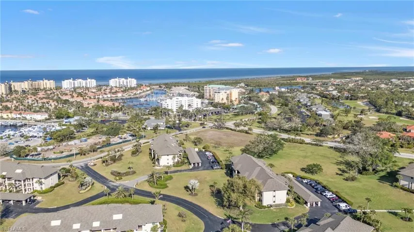 Birds eye view of property with a water view and a city view