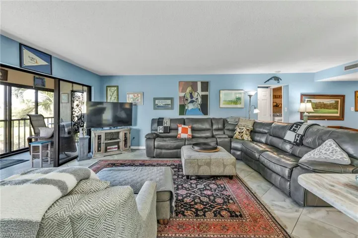 Living room featuring a textured ceiling and visible vents