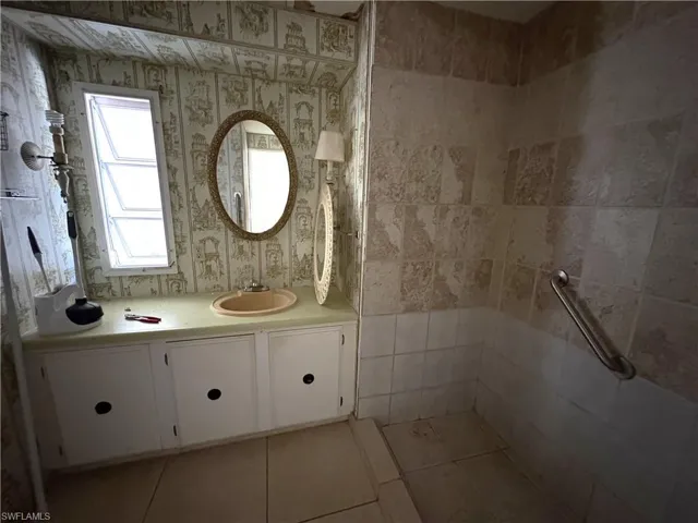 Bathroom featuring vanity and light tile patterned floors