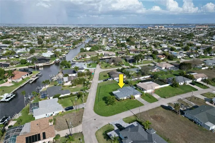 Aerial view of residential area with a large body of water