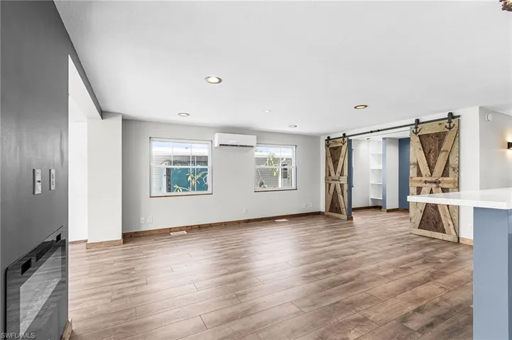 Large family room open to 3rd bedroom/den/music room
