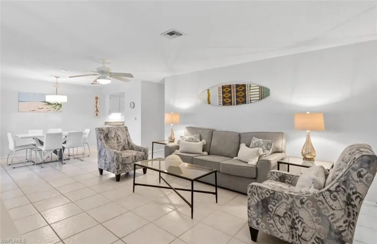Open-concept living and dining area featuring tile flooring throughout