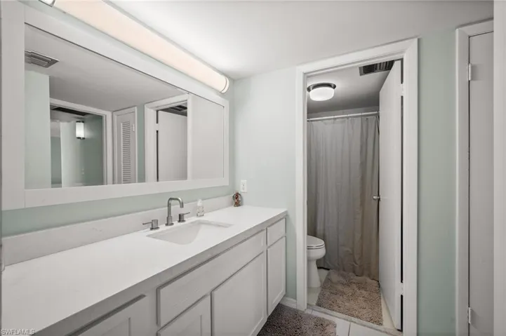 Bathroom with curtained shower