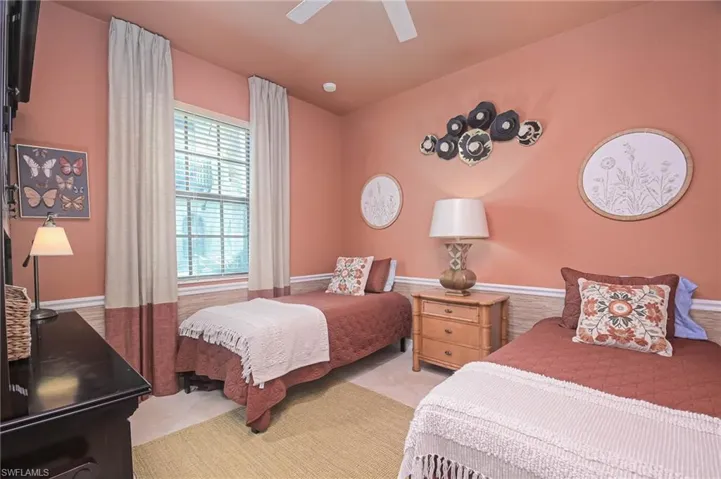 Main Level Guest bedroom with ceiling fan