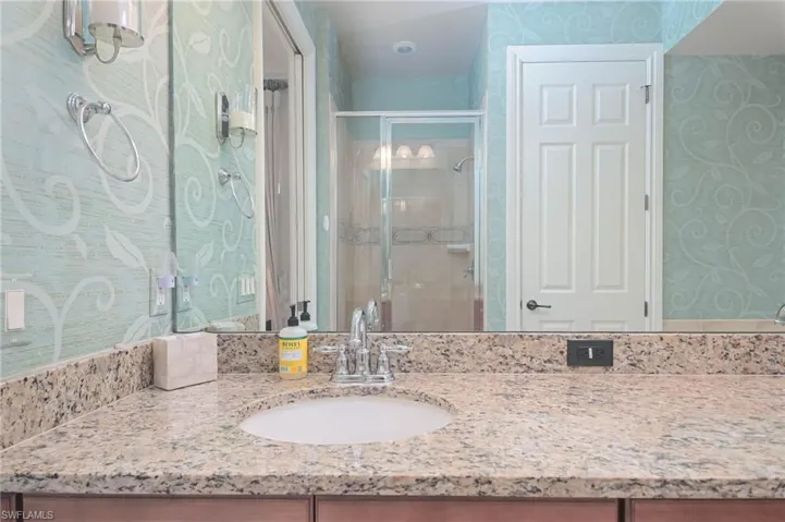 Master Bathroom with vanity and an enclosed shower