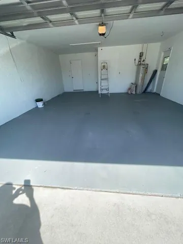 Garage featuring water heater