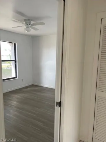 Unfurnished room with light tile patterned floors, ceiling fan, and plenty of natural light